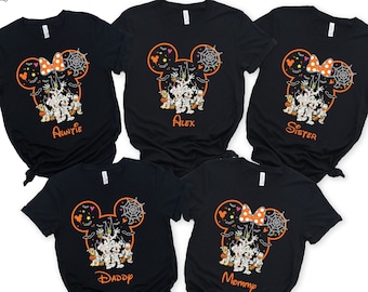 May include: Five black t-shirts with a Mickey Mouse head design featuring a spiderweb, a bow, and a group of Halloween characters. The shirts have the words "Auntie", "Alex", "Sister", "Daddy", and "Mommy" printed on them.