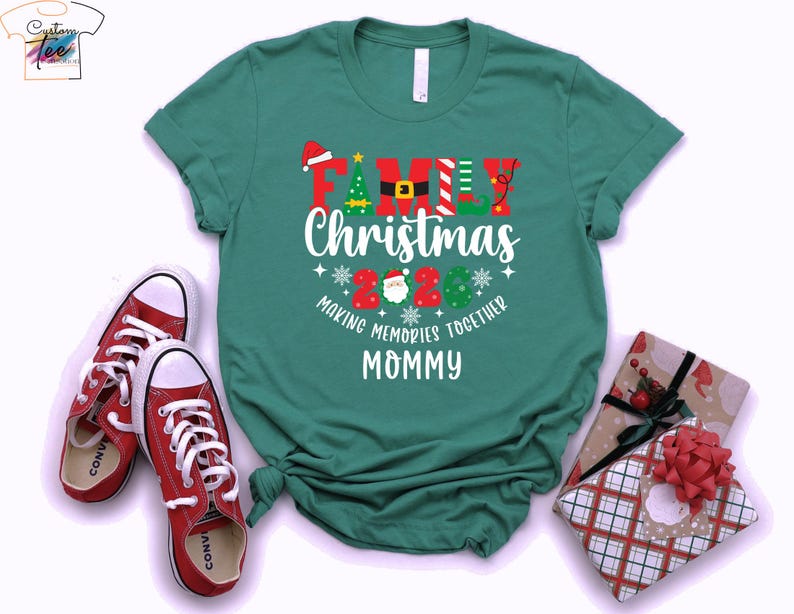 May include: A teal t-shirt with the text "Family Christmas 2020 Making Memories Together Mommy" in red, white, and green. Red trainers and wrapped gifts with red bows are also in the image.