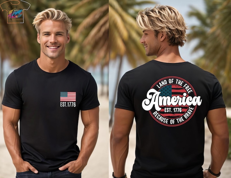 May include: A gray t-shirt with a small American flag on the front and a larger circle design on the back. The circle design features a larger American flag, the text "Land of the Free", "America", "Est. 1776", and "Because of the Brave".