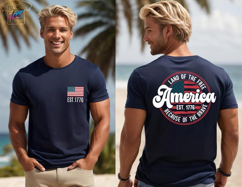 May include: A gray t-shirt with a small American flag on the front and a larger circle design on the back. The circle design features a larger American flag, the text "Land of the Free", "America", "Est. 1776", and "Because of the Brave".