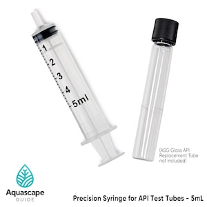 May include: A clear 5ml precision syringe with black markings and a black stopper, next to a clear glass tube with a black cap. The text reads "Precision Syringe for API Test Tubes - 5mL". The Aquascape Guide logo is also visible.