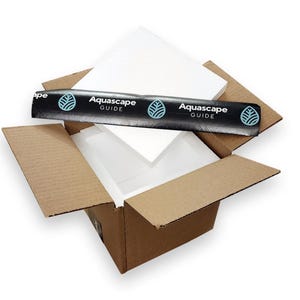 May include: A brown cardboard box with a white polystyrene insert. The box is open and the polystyrene is visible. The box has a black and white label that says "Aquascape Guide" on it.