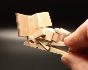 Tiny Robot Automaton reading a book (it turns it's head when you squeeze the clothespin!)