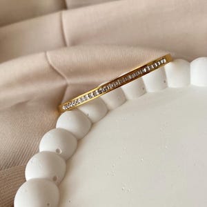 Gold stone handcuff bracelet, Gold stainless steel, sequential stoned stainless steel bangle