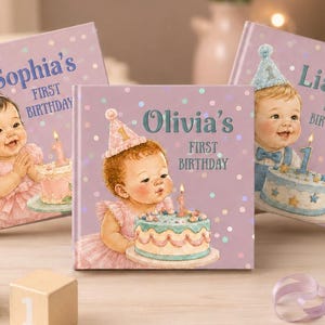 May include: Three square books with lavender covers featuring illustrations of babies in party hats with birthday cakes. The books are personalized with the names Sophia, Olivia, and Liam, each followed by the text First Birthday. Pastel blocks and a party hat are arranged in front.