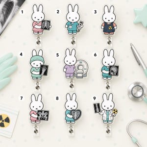 May include: A collection of nine acrylic badge reels featuring the character Miffy dressed in various medical scrubs and lab coats, each holding different medical imaging equipment like X-rays, a CT scanner, and radiation symbols, numbered one through nine.