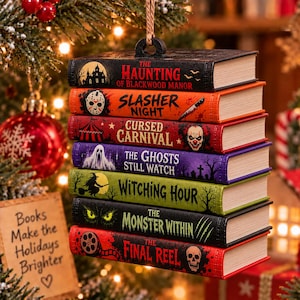 May include: A hanging ornament featuring a stack of seven miniature books with horror-themed titles and illustrations, including The Haunting of Blackwood Manor, Slasher Night, Cursed Carnival, The Ghosts Still Watch, Witching Hour, The Monster Within, and The Final Reel.