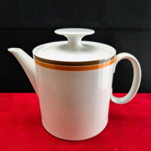 Thomas | Tekanna (längd från handtag till pip 19,0 cm | diameter 11,0 cm | höjd 14,0 cm) med brun och orange kant | Vintage