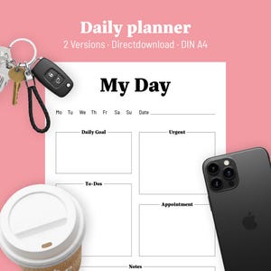 Könnte beinhalten: Ein weißer Tagesplaner mit dem Titel "My Day" und Abschnitten für Ziele, Aufgaben und Termine. Ein schwarzes Smartphone, Autoschlüssel und eine Kaffeetasse sind ebenfalls im Bild. Der Planer hat oben den Text "Daily planner".