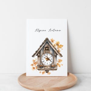 May include: A watercolor illustration of a cuckoo clock with a bird on the face. The clock is surrounded by autumn leaves and the text "Alpine Autumn" is at the top of the image.