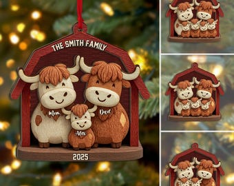 May include: A wooden Christmas ornament featuring a family of three Highland cows inside a red barn. The ornament is personalized with "The Smith Family" and the year "2025". The cows are brown and cream-colored with smiling faces.