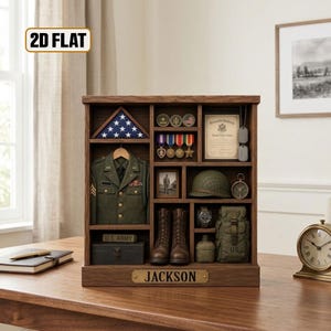 May include: A wooden display case featuring a folded American flag, a green military jacket, medals, a certificate, a helmet, boots, a watch, a canteen, and a bag. A brass plaque at the bottom is engraved with the name JACKSON.