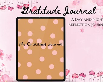 Può includere: Un tablet digitale con sfondo marrone e pois rosa. Il testo "My Gratitude Journal" è scritto sullo schermo. Il tablet è circondato da uno sfondo rosa con fiori rosa.