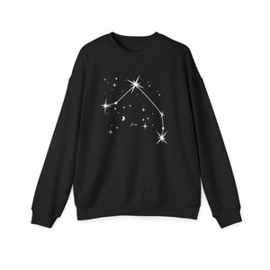 May include: Black sweatshirt with a white constellation design and the word "Aries" printed on the front.