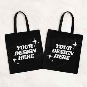 Puede incluir: Dos bolsas de tela negras con estrellas blancas y el texto "Your Design Here" impreso en ellas.
