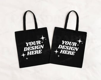 May include: Two black tote bags with white stars and the text "Your Design Here" printed on them.