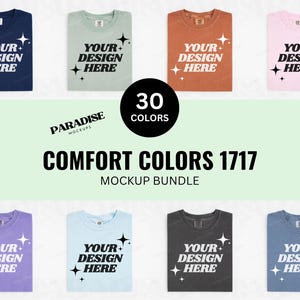May include: A mockup bundle of Comfort Colors 1717 t-shirts in various colours, including navy, sage green, rust, and pink. Each shirt is folded and displays the text "YOUR DESIGN HERE" with star graphics. The image also includes a circle with "30 COLOURS" and the text "COMFORT COLORS 1717 MOCKUP BUNDLE".