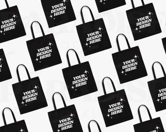 May include: Multiple black tote bags with white text that reads "Your Design Here" and small white stars. The bags are arranged in a repeating pattern on a white background.