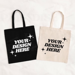 May include: Two tote bags, one black and one beige, with the text "Your Design Here" and a star design.