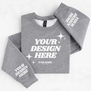 Puede incluir: Una sudadera gris jaspeado con el texto blanco "YOUR DESIGN HERE" y estrellas. Las mangas también muestran el texto "YOUR DESIGN HERE". La sudadera es de cuello redondo.