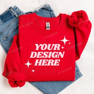 May include: Red long-sleeved sweatshirt with the text "YOUR DESIGN HERE" in pink letters and white stars.
