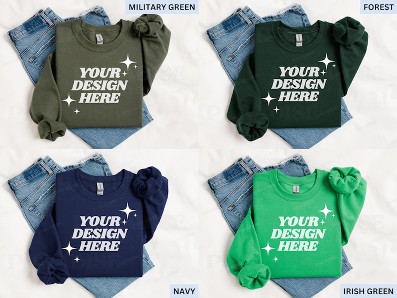 May include: Four crewneck sweatshirts in military green, forest green, navy, and Irish green, each with the text "YOUR DESIGN HERE" in white. The sweatshirts are displayed on top of blue jeans.