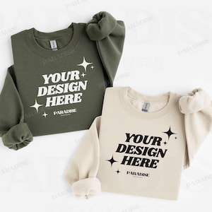 Könnte beinhalten: Zwei Sweatshirts, eines in Olivgrün und eines in Creme, werden gezeigt. Jedes hat den Text "YOUR DESIGN HERE" in einer fetten, stilisierten Schriftart mit Sternen-Grafiken. Der Markenname "PARADISE" steht darunter.