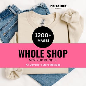 May include: A mockup bundle featuring a cream-colored sweatshirt and blue jeans, laid flat on a white surface. The sweatshirt has a tag and is folded. A pink banner displays "WHOLE SHOP MOCKUP BUNDLE" with "1200+ IMAGES" in a black circle.