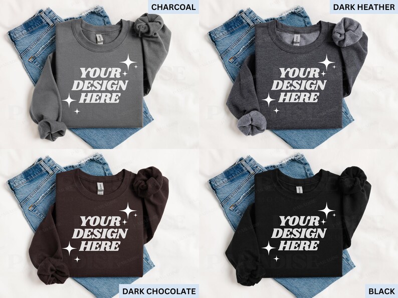 May include: Four sweatshirts in charcoal, dark heather, dark chocolate, and black, each with the text "YOUR DESIGN HERE" and starburst graphics. The sweatshirts are displayed on top of blue jeans.