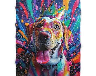 May include: A vibrant, colorful blanket featuring a dog wearing a crown. The dog's fur is painted with rainbow hues, and the background is a splash of bright colors. The dog has its tongue out, and the blanket is a soft, cozy material.