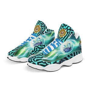 May include: A pair of white basketball shoes with a blue and green abstract pattern and a smiley face graphic. The shoes have a white sole and a black trim.