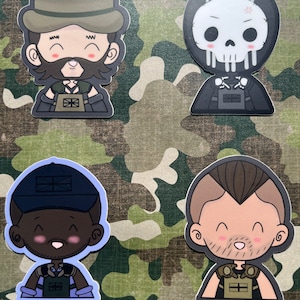 May include: Four cartoon character stickers with different facial expressions. Each character is wearing a vest with a Union Jack flag and a different hat. The characters are a man with a beard and a brown hat, a skull with a black hood, a man with a black hat, and a man with a brown mohawk.