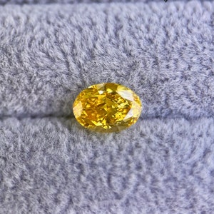 AIG certified 1.81ct Fancy Vivid Yellow Natural Diamond with HPHT treatment