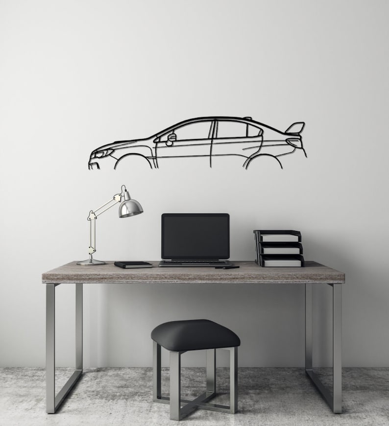 May include: Black metal car outline wall art, mounted on a white wall. The artwork shows the side profile of a car, with details like windows, doors, and a spoiler. The car art is above a desk with a laptop, lamp, and stool, creating a modern aesthetic.