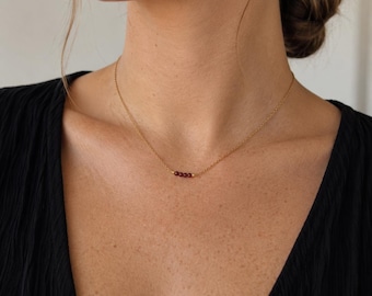 Delicate necklace with small red garnet beads