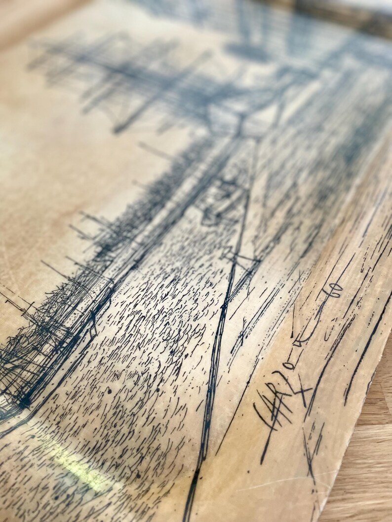 May include: A black and white drawing on a beige paper background. The drawing is of a city skyline with buildings and streets. The drawing is signed "HARPER" in the bottom right corner.