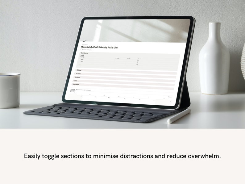 ADHD digital planner displayed on laptop screen with clean, minimal workspace aesthetic.