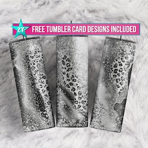 May include: Three black and white tumblers with a leopard print design and a glittery finish. The tumblers are on a white fluffy surface. "27 FREE TUMBLER CARD DESIGNS INCLUDED" is written in pink and blue text at the top of the image.