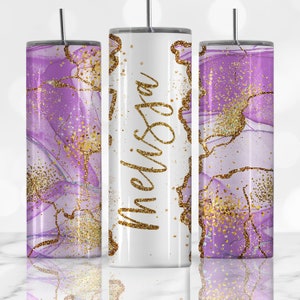 May include: Three stainless steel tumblers with a purple and gold marble design. The middle tumbler has the name "Melissa" written in gold glitter.