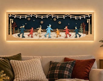 May include: A rectangular wooden wall art piece featuring a layered 3D scene of seven figures ice skating on a white rink. The dark blue background includes hanging string lights, snowflakes, and two street lamps. The frame is illuminated by LED lights.