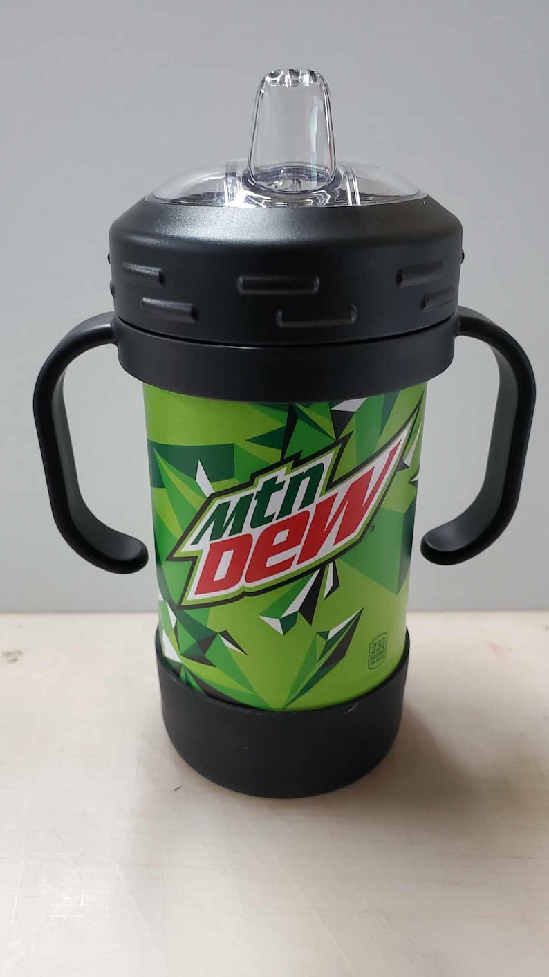 May include: Green and red Mountain Dew branded stainless steel sippy cup with black handles and a clear lid.