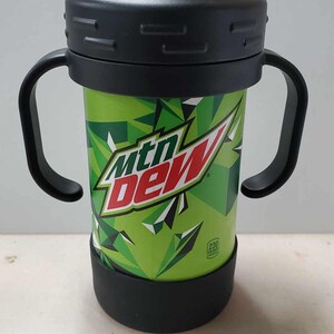 May include: A black and green Mountain Dew branded sippy cup with two handles. The cup has a clear plastic lid with a spout.