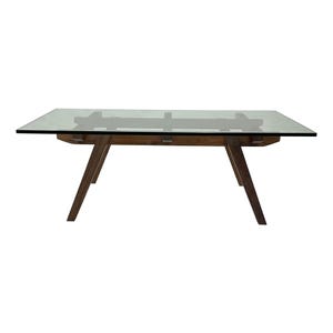 May include: A rectangular dining table with a clear glass top and a wooden base. The base has angled legs and a dark brown finish. The table is designed for seating and dining.