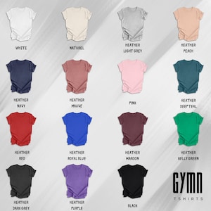 Pode incluir: Um gr&aacute;fico que mostra 14 cores diferentes de camisetas com o texto "GYMN TSHIRTS" na parte inferior. As cores incluem branco, natural, cinza claro mesclado, p&ecirc;ssego mesclado, azul marinho mesclado, malva mesclado, rosa, azul escuro mesclado, vermelho mesclado, azul royal mesclado, vinho mesclado, verde kelly mesclado, cinza escuro mesclado e roxo mesclado.