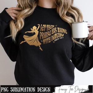May include: A black sweatshirt with a gold design featuring a dancing woman and the text "Let them praise His name with dancing - Psalm 149:3".
