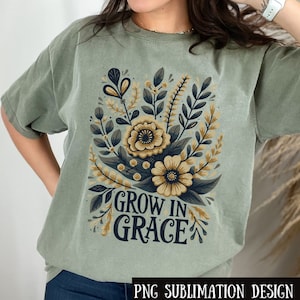 Könnte beinhalten: Ein grünes T-Shirt mit einem floralen Design und dem Text "Grow in Grace".