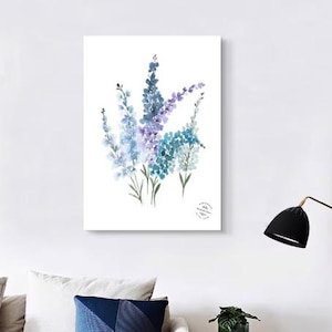 May include: Watercolor painting of blue and purple flowers on a white background. The artwork features a bouquet of delicate blooms with green stems. The painting is displayed on a white canvas, perfect for home decor.