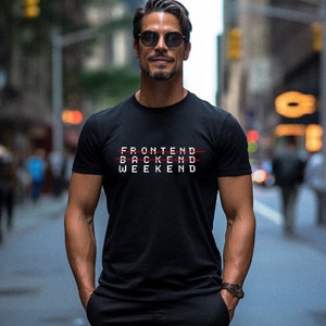 May include: A man wearing a black t-shirt with the words "FRONTEND", "BACKEND", and "WEEKEND" printed on it. The words "BACKEND" and "WEEKEND" are crossed out with a red line.
