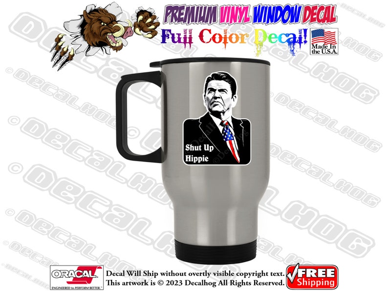 May include: A silver travel mug with a black handle and lid. The mug features a black and white image of a man with the text "Shut Up Hippie".