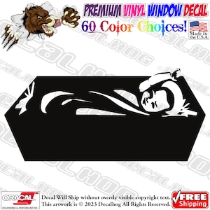 May include: Black and white silhouette of a person lying down in a coffin. The image is a vinyl window decal.